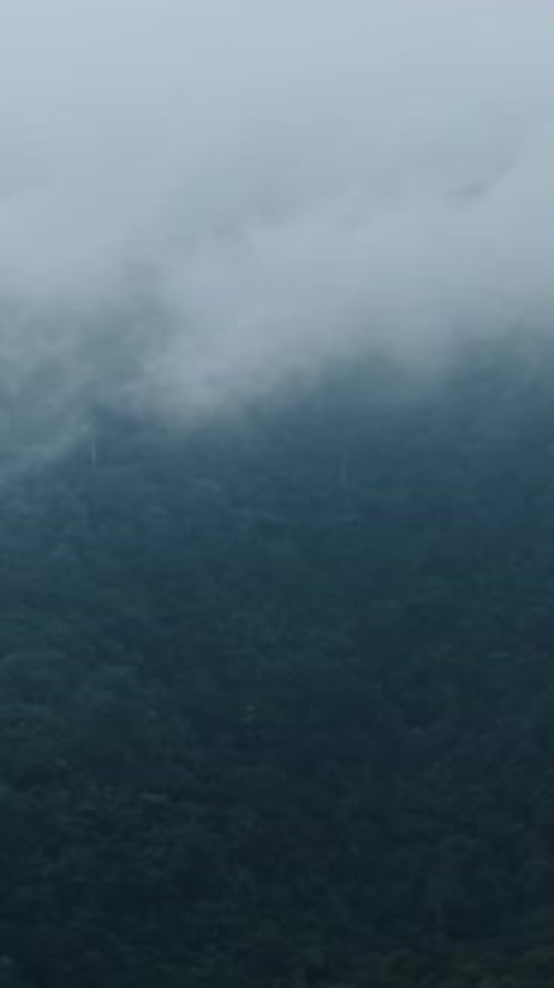 Clouds Moving Over a Mountain Range Covered in Lush Vegetation in Mae Wong National Park Thailand