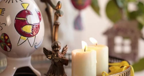 Handcrafted Easter Decorations for a Joyful Holiday Atmosphere Featuring Candles and Angel Figurine