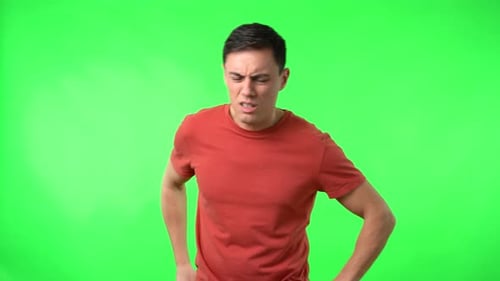 Young Man Coughing with Tissue on Green Screen