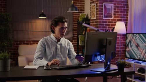 Young Adult Shopping Online with Credit Card at Home