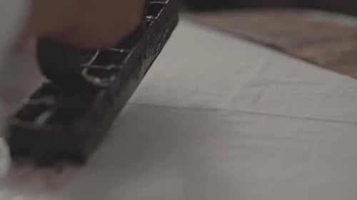 Batik Stamp Process, Look a Man Hands Applying Wax in to Fabric