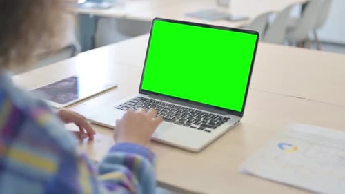 Close up of Young African Woman Using Laptop with Green Screen
