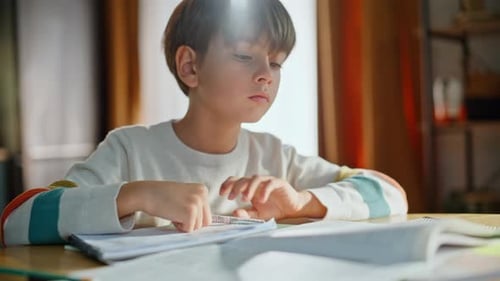 School Student Writing Pen Making Notebook Notes Sitting Kitchen Table Closeup