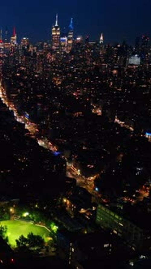 Night New York city aerial view. Perspective of New yorl scyscrapers street.