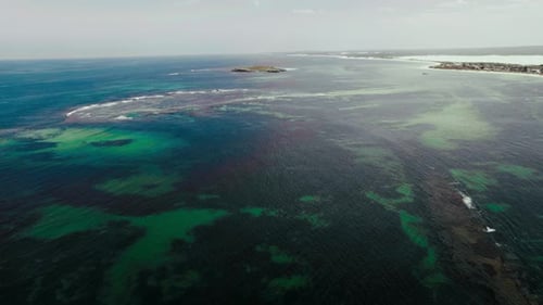 Aerial view of serene ocean and coastline at daytime