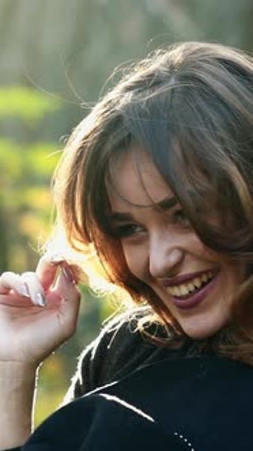 Autumn woman in autumn park. Autumn woman in autumn park. Warm sunny weather. Fall concept