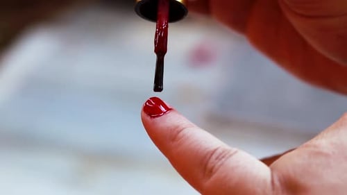 Applying Red Nail Polish Close Up Beauty Shot
