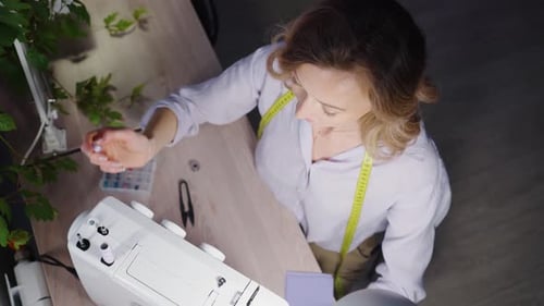 Female Seamstress Working at Sewing Machine Designer Workshop Fashion Atelier Tailor