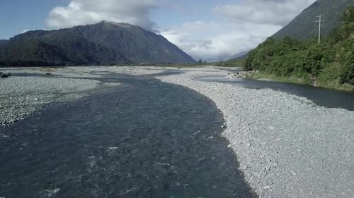 Aerial View of the Taramaku River Along the Countryside and Hills New Zealand