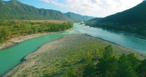 Low Altitude Flight Over Fresh Fast Mountain River with Rocks at Sunny Summer Morning
