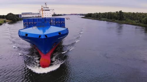 Orbit Shot Of Huge Blue Tailwind Panda Container Ship Sailing In Oude Maas River, Netherlands
