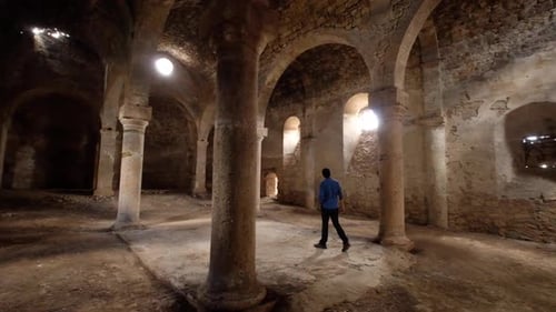 Tourist Visiting The Ancient Stone Church 3