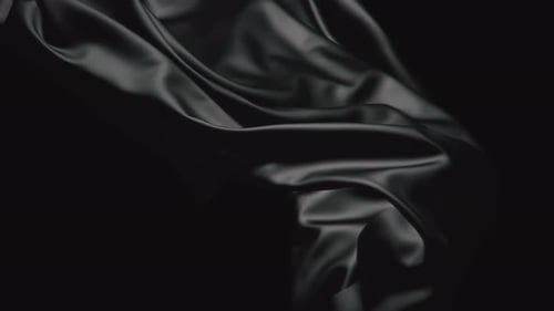 Close-up Black Satin Fabric, Wind-Blown Look. Seamless Looping Animation.
