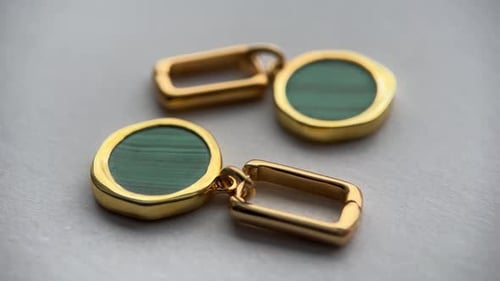 Gold Jewelry Components on Gray Background