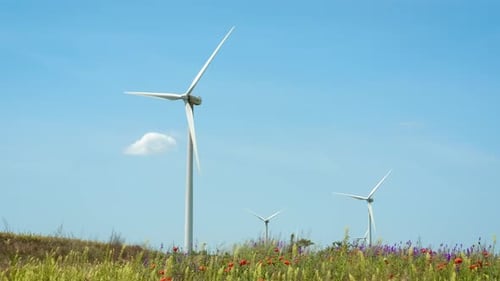 Wind Turbine Rotating with Clouds Passing By