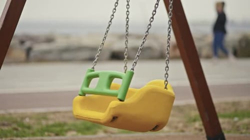Lonely Swing Swaying in a empty park.