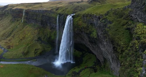 Breathtaking Aerial View of a Majestic Waterfall in Green Iceland