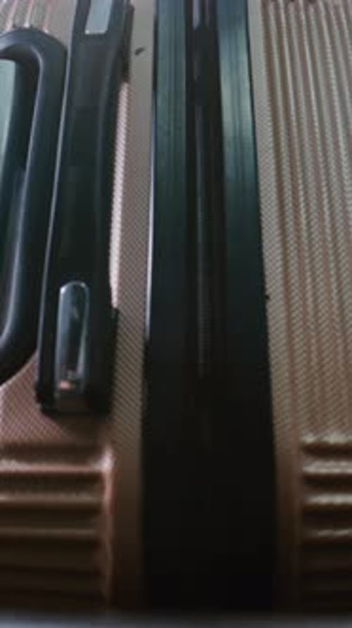 Airport Security Checkpoint Close Up of Passenger Placing Suitcase on Conveyor Belt for Baggage Xray