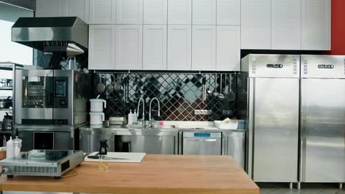 Professional commercial empty clean modern kitchen in restaurant or cafe Metal kitchen equipment