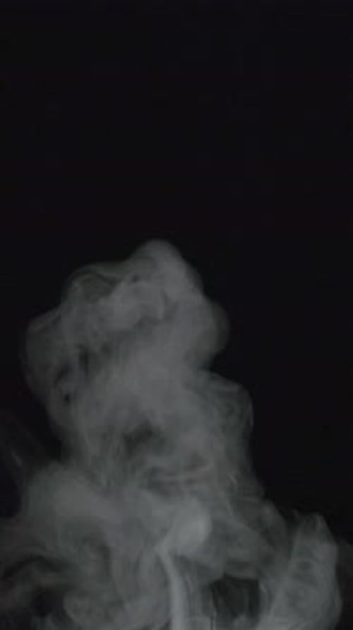Abstract White Vapor Flowing on Black Background