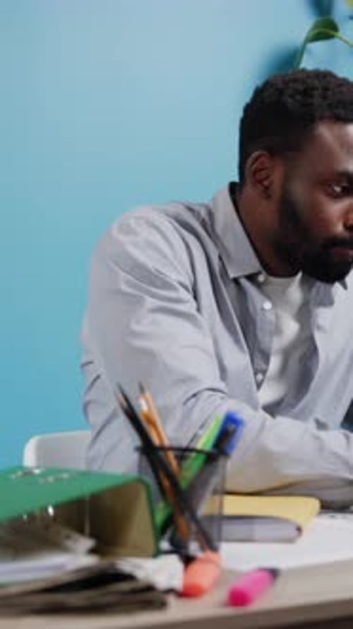 A Focused Professional Engaged in Work Within a Contemporary Office Environment Setting