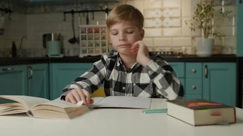 Bored Boy Doing Homework at Home