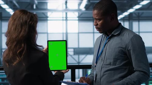 Workers Using Mockup Device in Server Room Checking Infrastructure Reliability