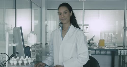 Woman Scientist Standing in Research Laboratory