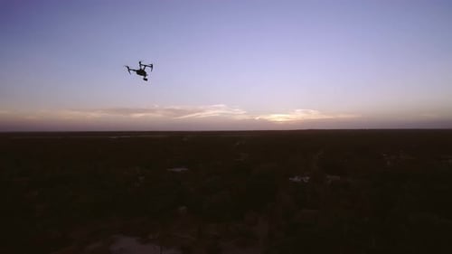 Aerial Drone Quad Copter Footage Flying Over Tropical Area And Towards The Sun.