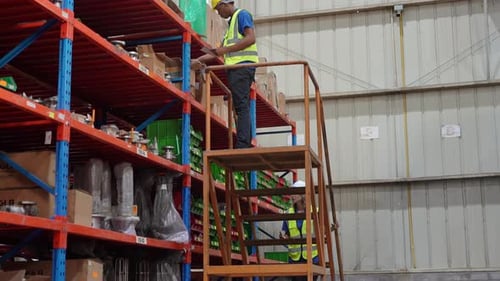 Worker Doing Inventory in Warehouse. Dispatcher in uniform making inventory in storehouse. supply ch