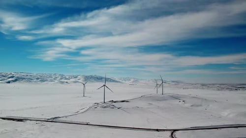 Wind Turbine In A Snowy Landscape