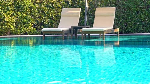 Empty Pool Chairs on Poolside of Luxury Hotel Resort, Full Frame