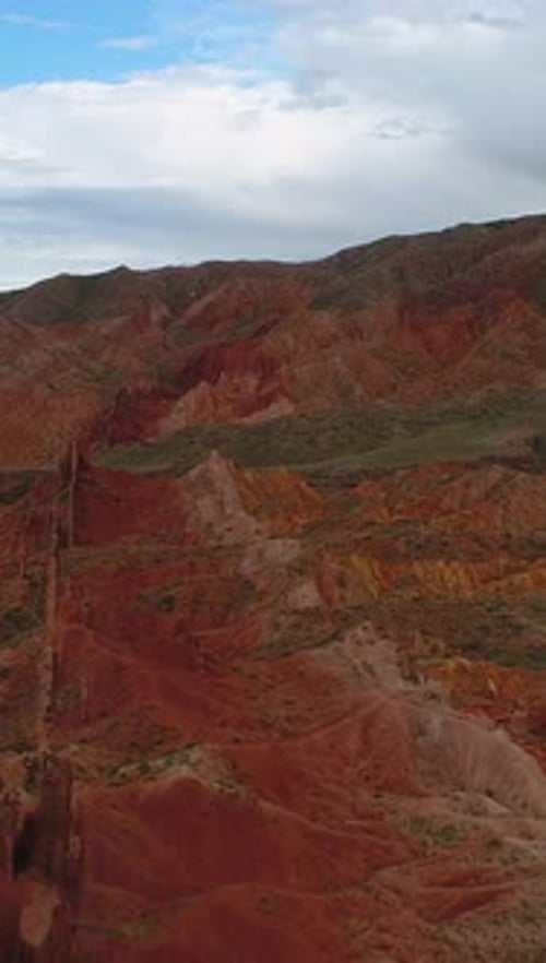 Flying Back Over Red Canyon Rocks Martian Landscape Blue Sky Aerial View Vertical Video