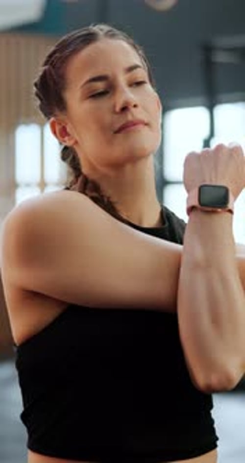 Fitness, gym and woman stretching arms for muscle training or workout for health, wellness or body