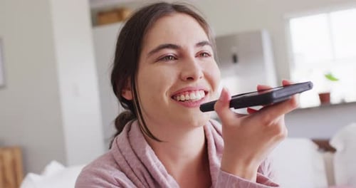 Woman Talking on Smartphone Indoors