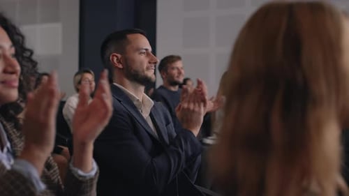Audience Clapping at Corporate Presentation or Conference Event