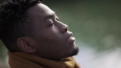 Man Looks Upward with Calm Expression Close Up