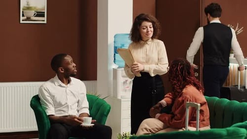 Hotel Manager Taking Tourists Feedback