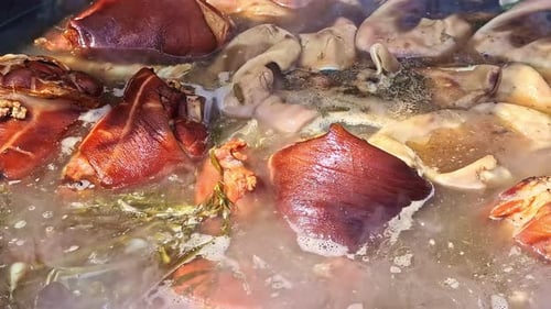 Simmering Meat and Herbs for Traditional Dish