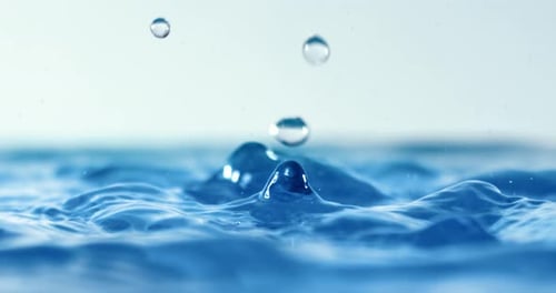 Water Drops Splashing Causing Ripples