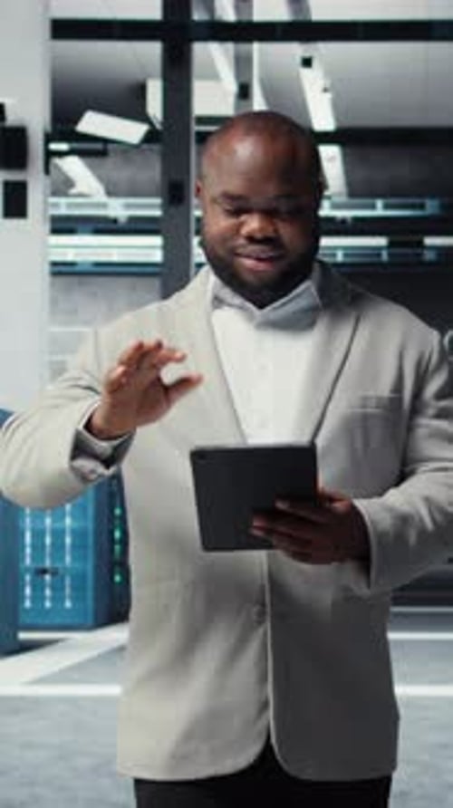 Vertical Video Smiling Admin Using Tablet in in Data Center Maintaining Infrastructure