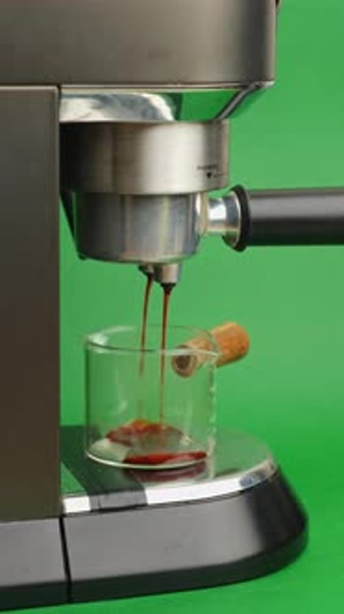 Rhythmic Espresso Pouring Captured In Clean Industrial Setting For Marketing Visuals