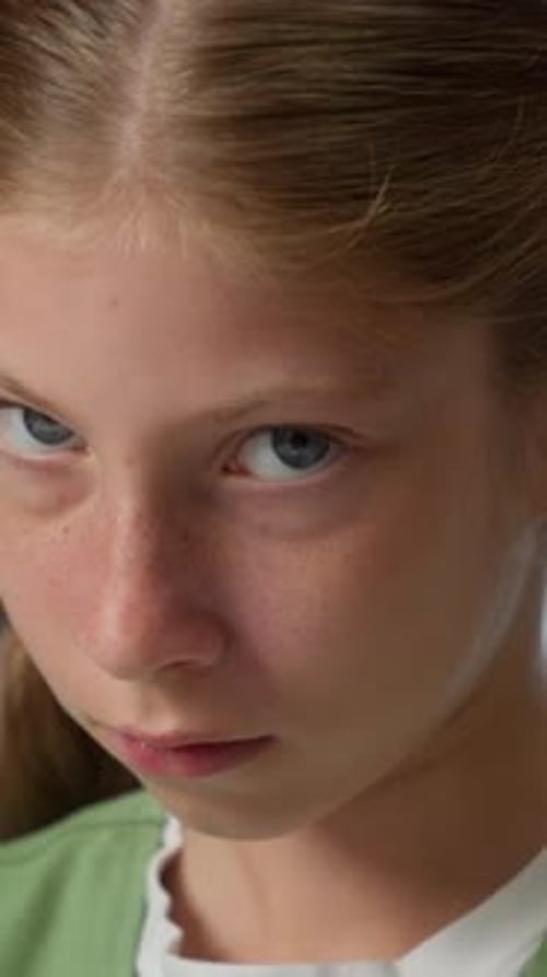 Close Up Headshot Sad Frustrated Offended Caucasian Little Girl Child Kid Daughter Looking at Camera