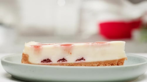 Cheesecake Slice Decorated with Mint Sprig Close Up