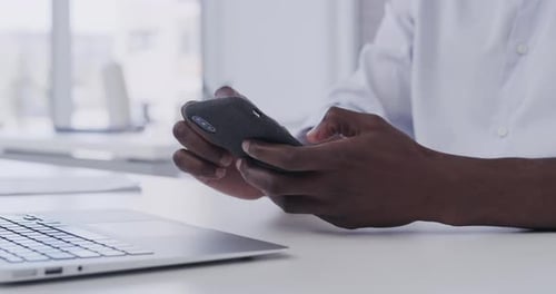 4k video footage of a businessman using his smartphone in his office