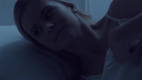 Woman Sleeping Peacefully in Bed at Night