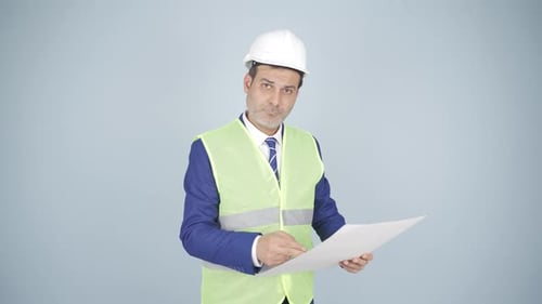 The engineer listens to the camera and does not approve.