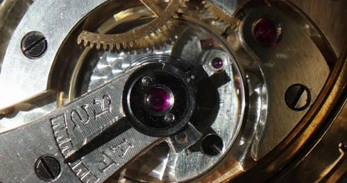 Watch Internal Mechanisms and Gears Rotating Macro
