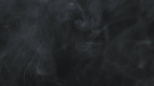 Atmospheric Wispy Smoke Flowing on Dark Background