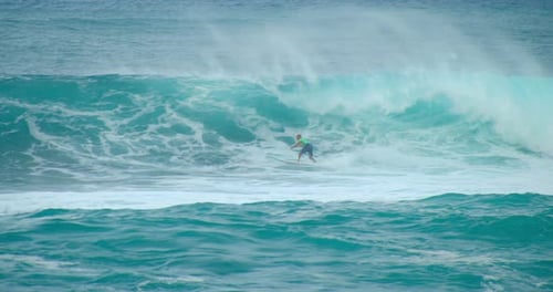 Surfer Riding A Large Ocean Wave, Slow Motion 4k